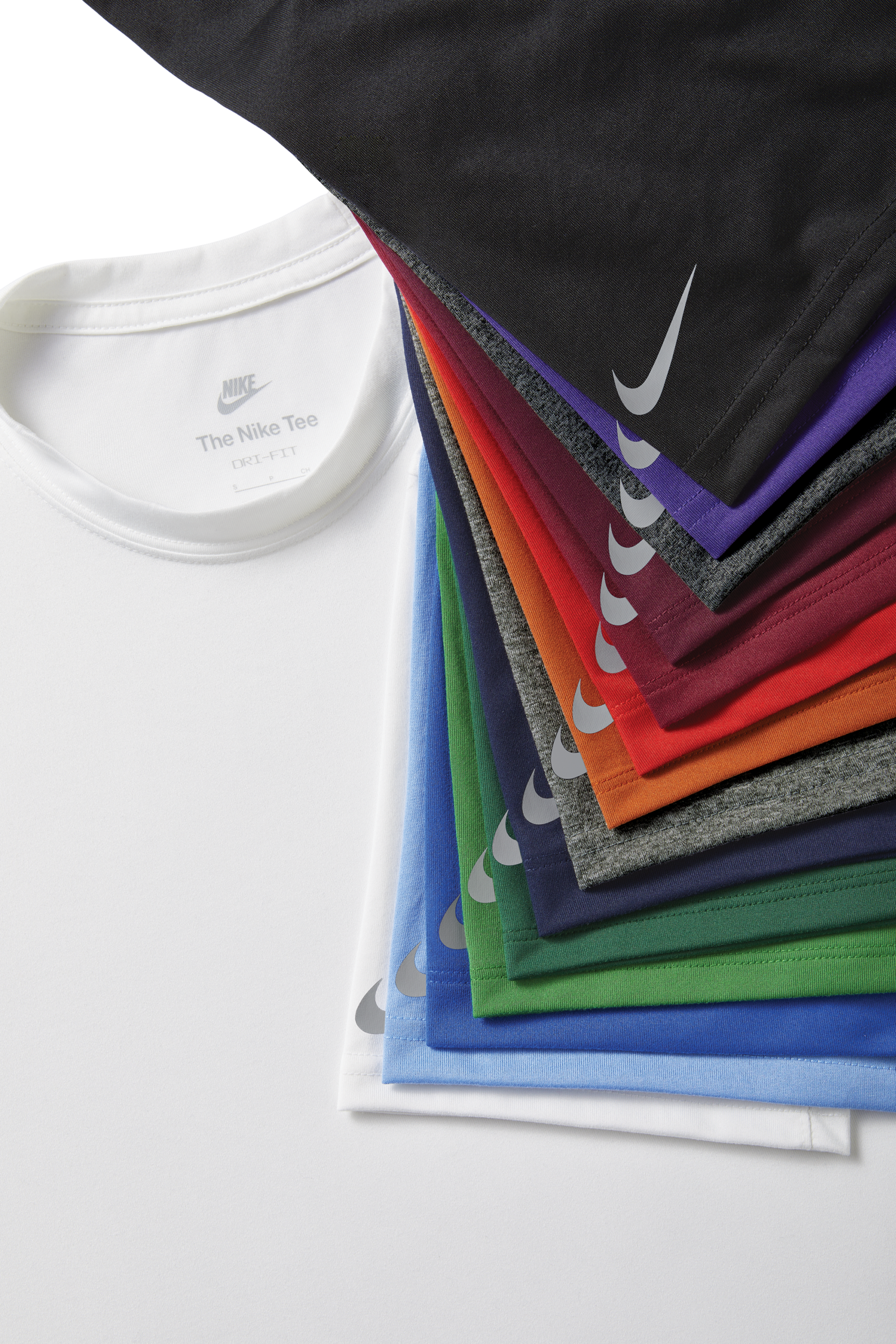 a stack of different colored Nike shirts layed out on top of each other